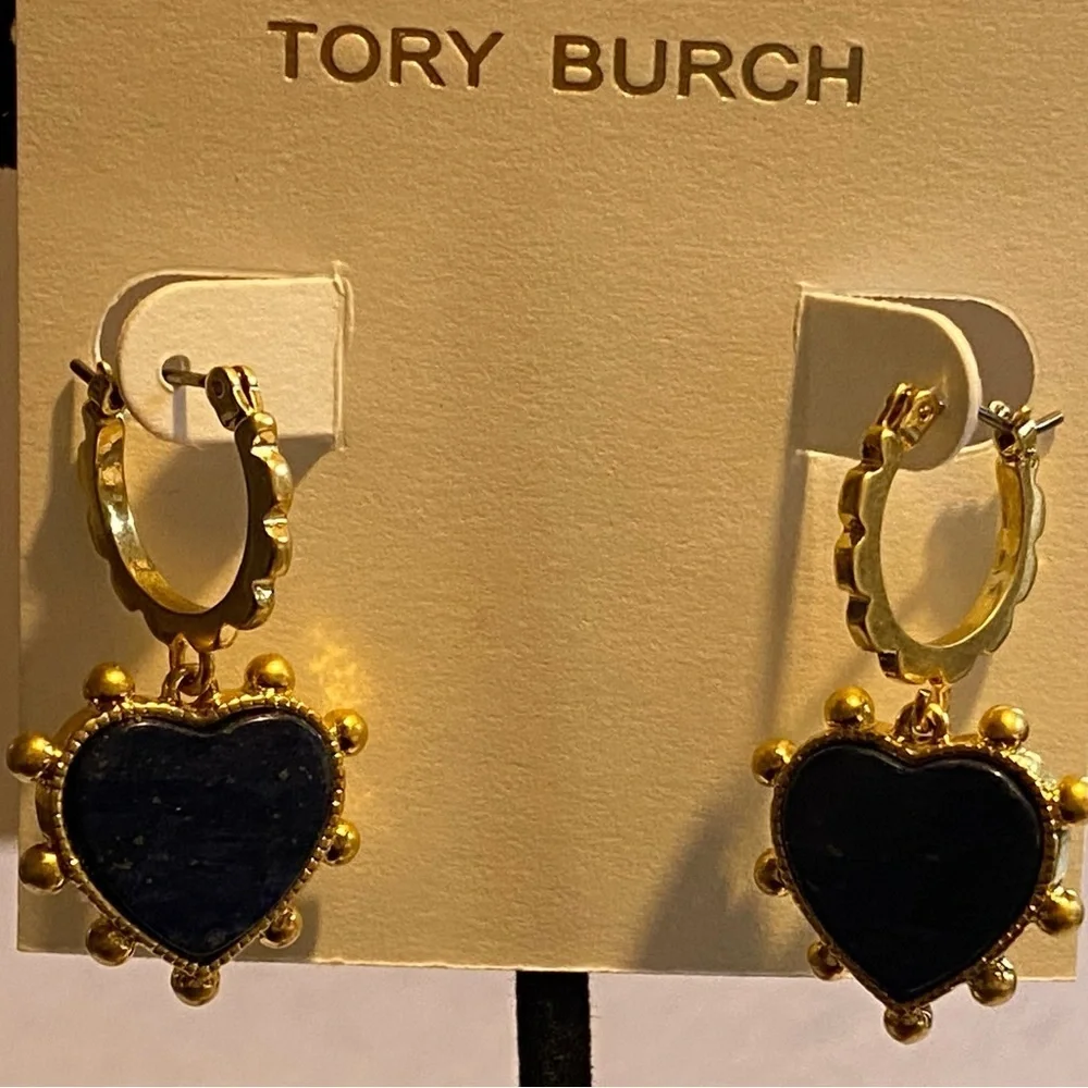 Tory Burch blue lapis heart drops hanging from huggie hoops.